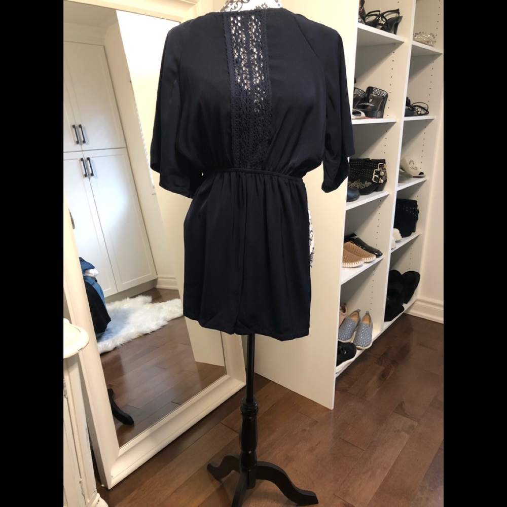 Navy playsuit with elasticized waist. Size 6 US